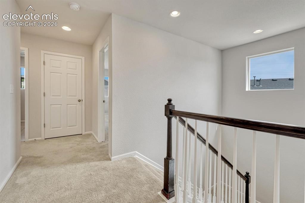 Image 37 of 50: Large walk in closet with a window in the Upper Level Primary Bathroom.