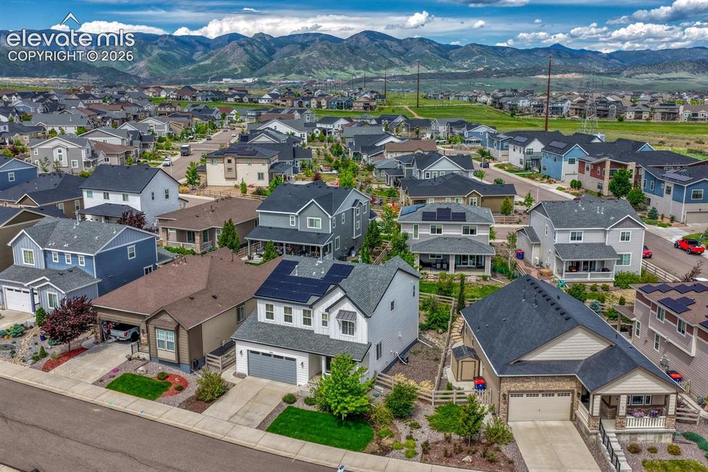 Image 48 of 50: Aerial view of home, neighborhood, and fabulous mountains.