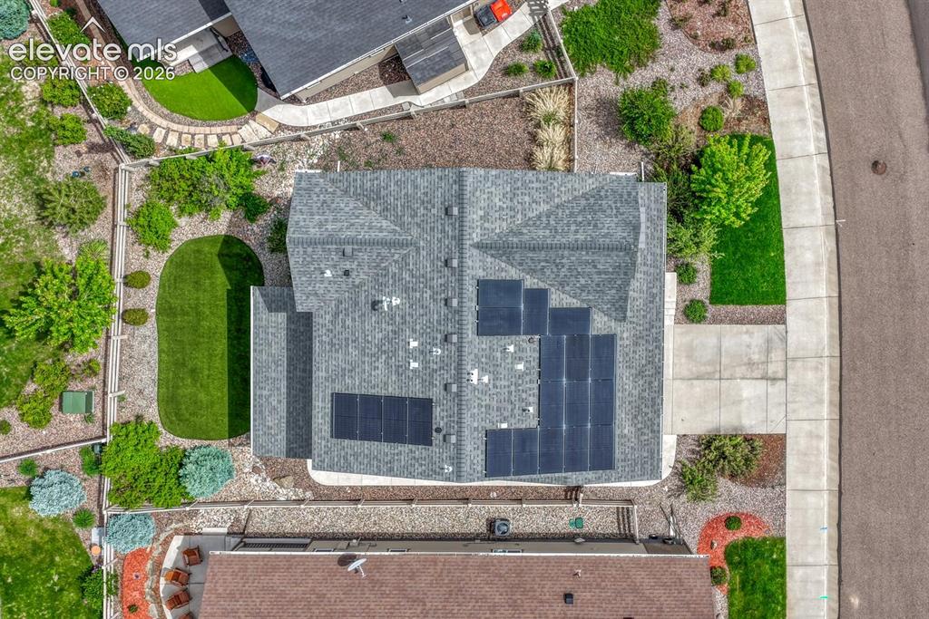Image 49 of 50: Aerial view of the front of the home, beautiful community, and mountain vie