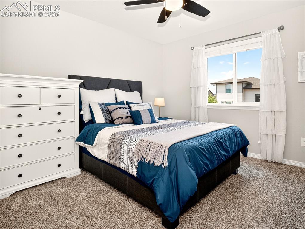 Image 25 of 48: Upper-level secondary room with walk-in closet.