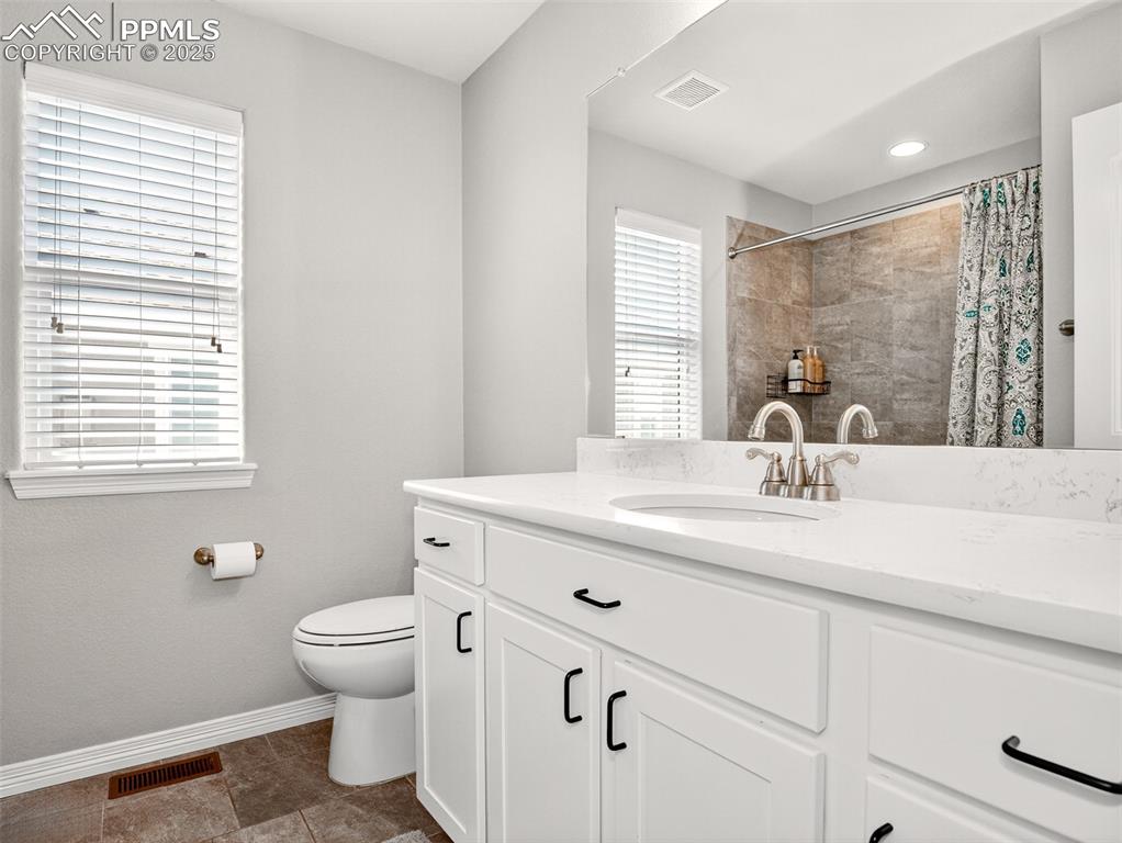 Image 27 of 48: Upper-level full bath has lots of counter space!