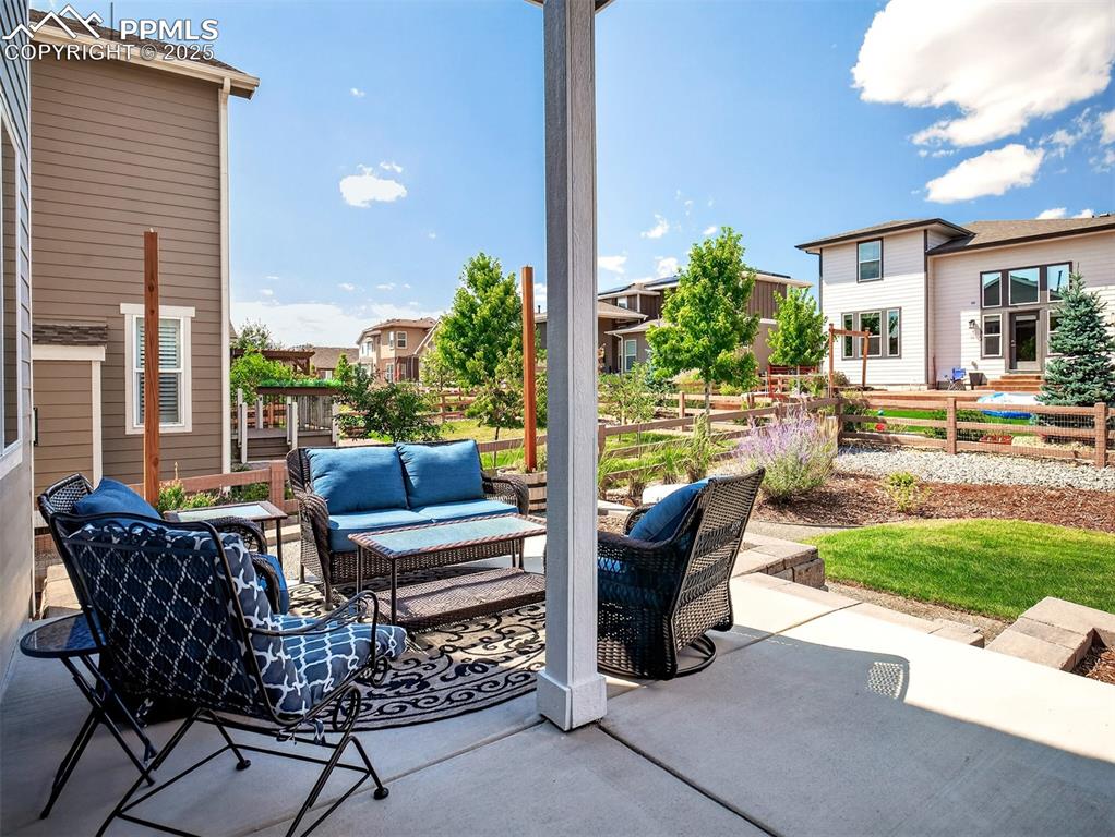 Image 38 of 48: Partially-covered rear patio... a great place to enjoy your favorite bevera