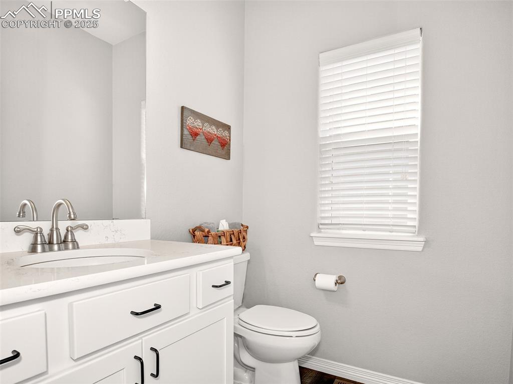Image 5 of 48: Main-level half bath.