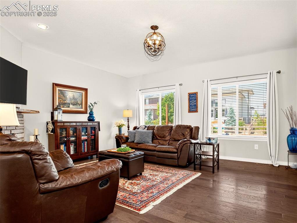 Image 6 of 48: Main-level family room with gas fireplace.