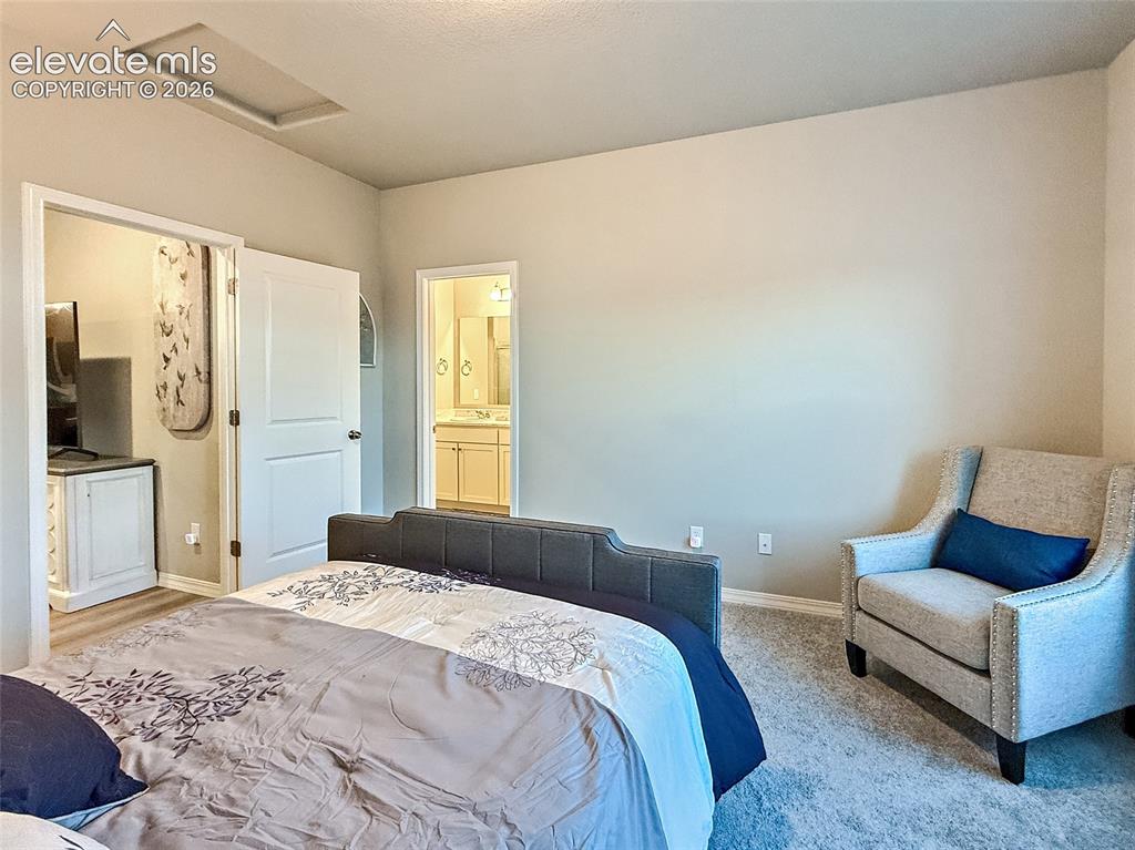 Image 8 of 24: Recessed ceiling detail with neutral wall tones and plush carpeting