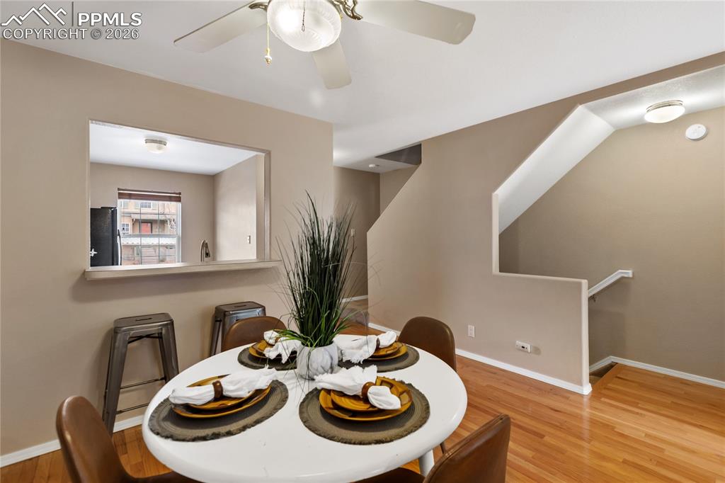 Image 11 of 37: There is a dining area along with a breakfast bar - perfect for entertainin