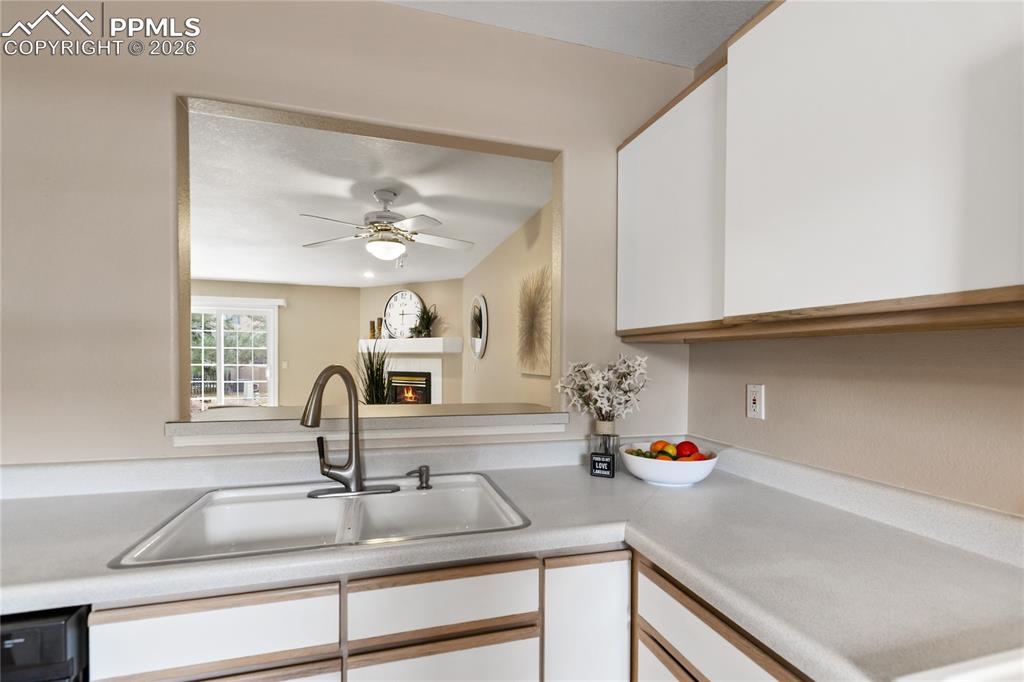 Image 18 of 37: The kitchen has this breakfast bar area that opens up to the dining area/li