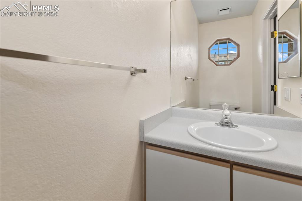 Image 19 of 37: A convenient powder room/half bath is located on the main level