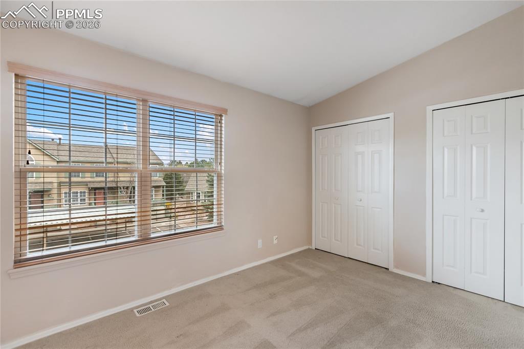 Image 31 of 37: Upper level bedroom 