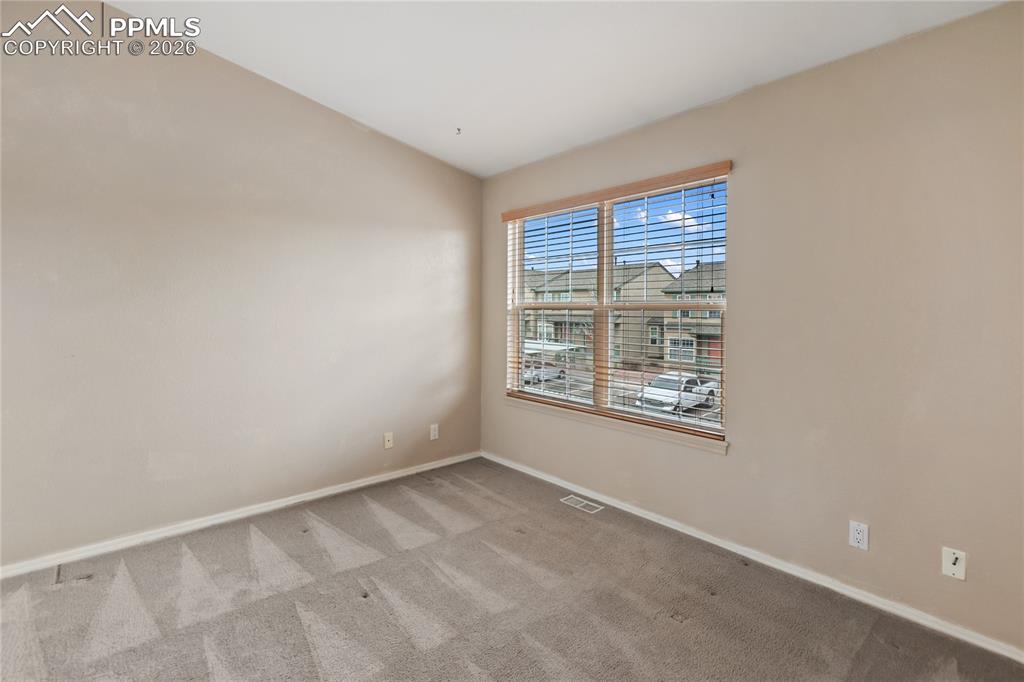 Image 32 of 37: Upper level bedroom