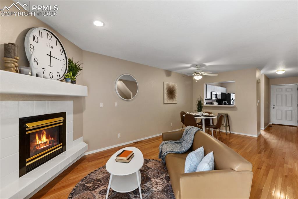 Image 7 of 37: The living room is open to the dining area/kitchen