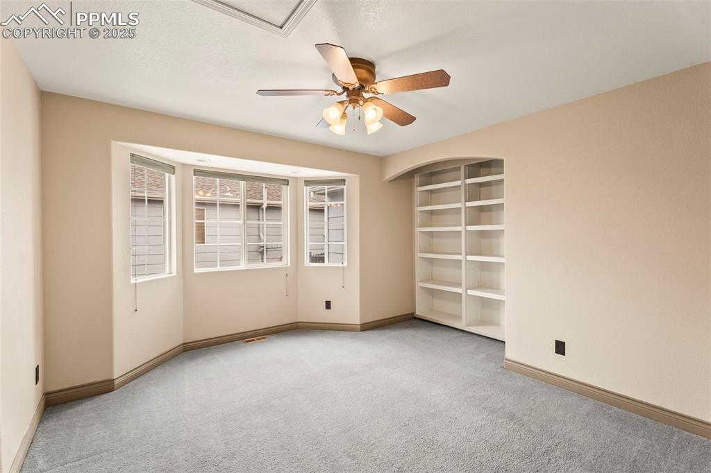 Image 16 of 34: Sitting area or office off master bedroom. 