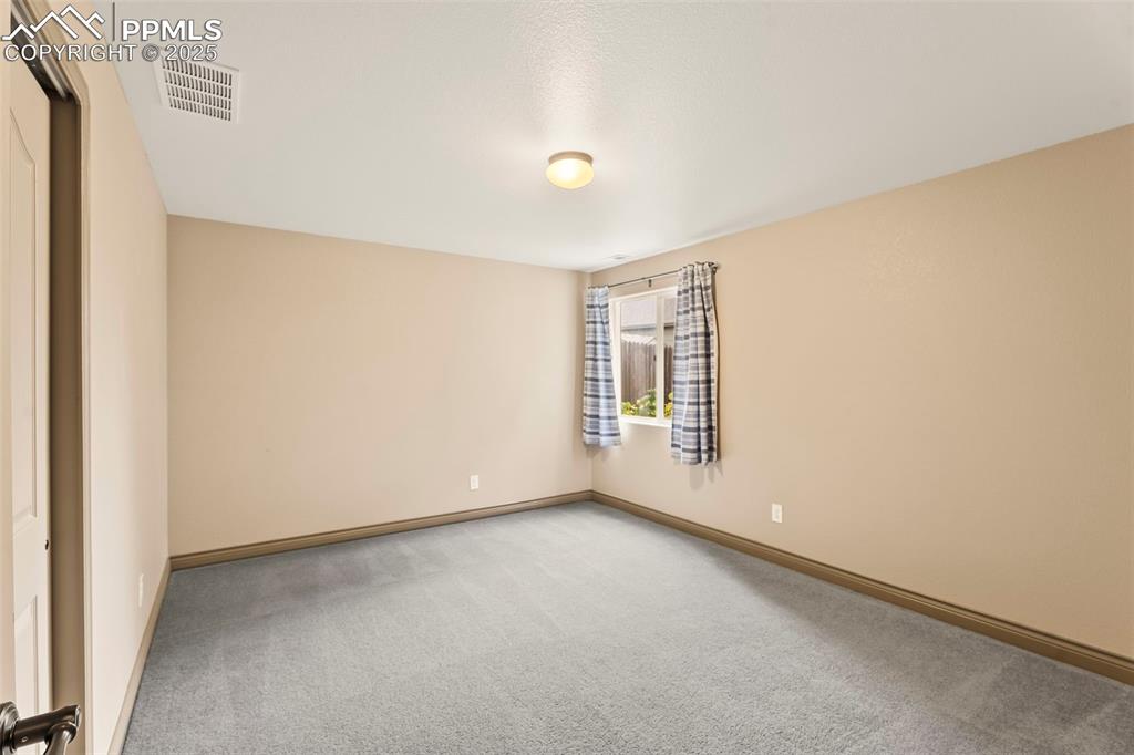 Image 23 of 34: Bedroom 1 in basement. 