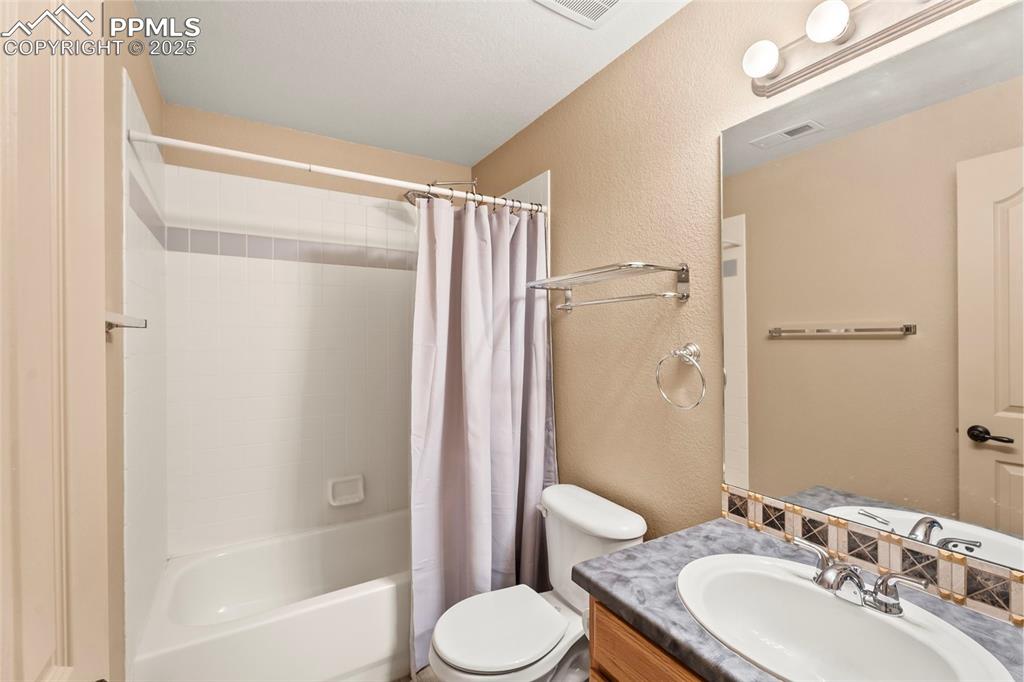 Image 24 of 34: Bath in basement