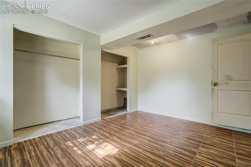 Image 18 of 24: Unfurnished bedroom with baseboards and a closet
