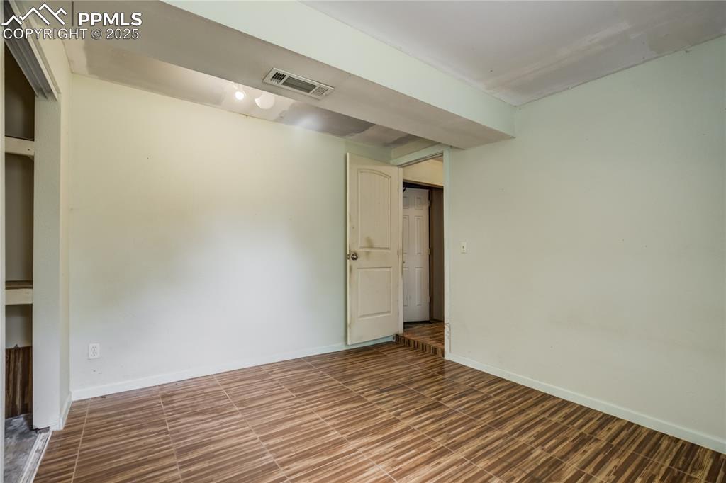 Image 19 of 24: Empty room featuring baseboards