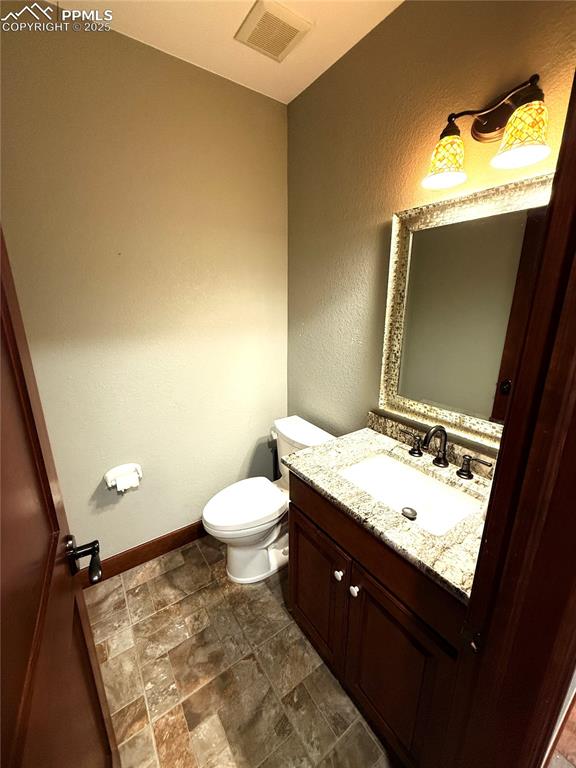Image 11 of 50: main floor half bath
