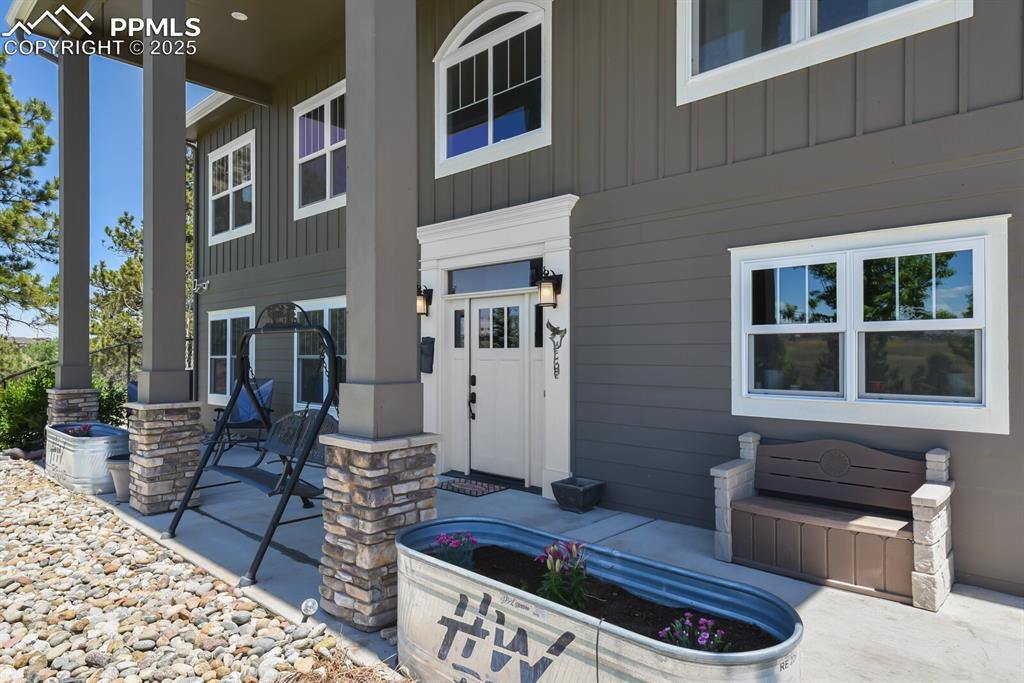 Image 3 of 50: Front covered patio