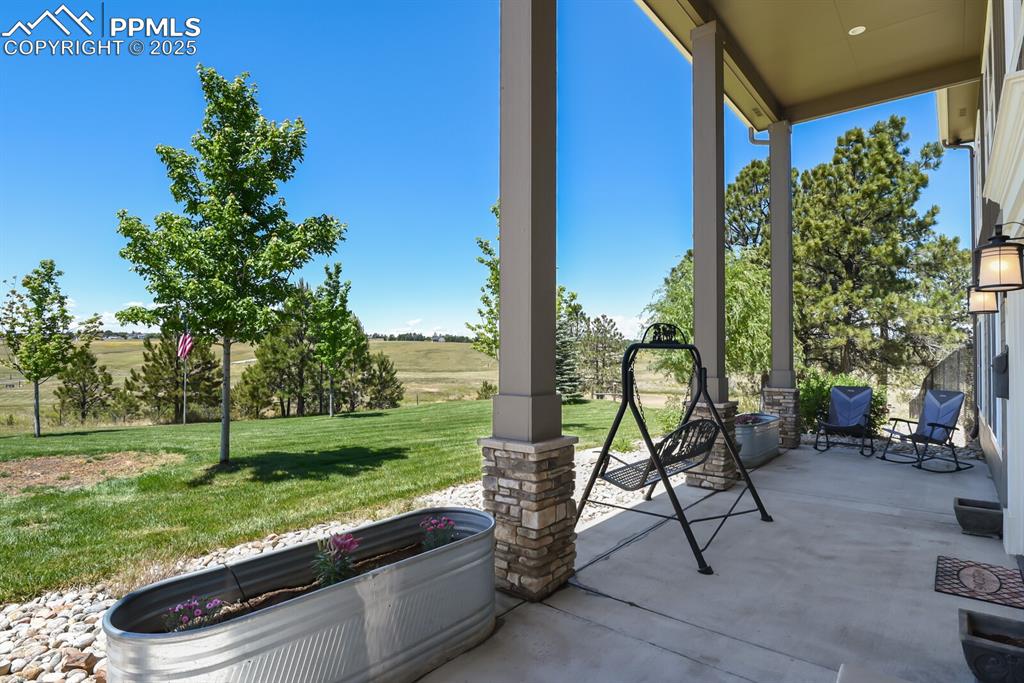 Image 4 of 50: front yard and covered patio