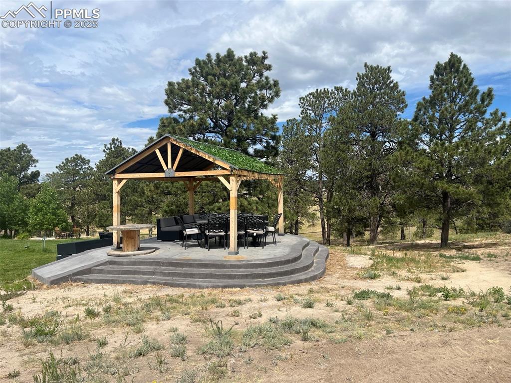 Image 41 of 50: Back of house with gazebo 