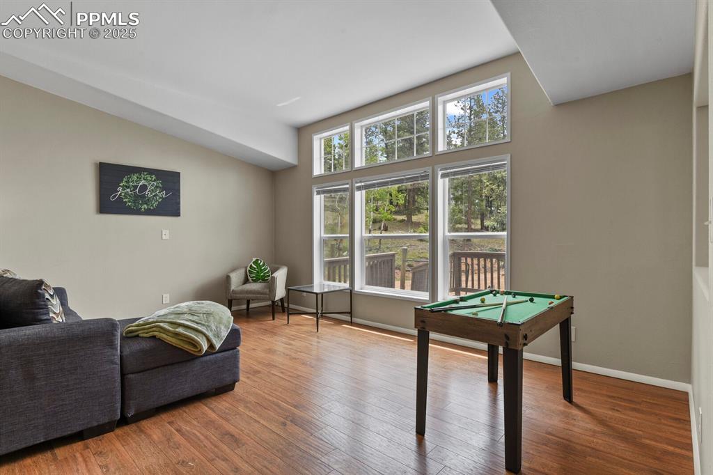 Image 7 of 37: Recreation room featuring pool table and hardwood / wood-style flooring