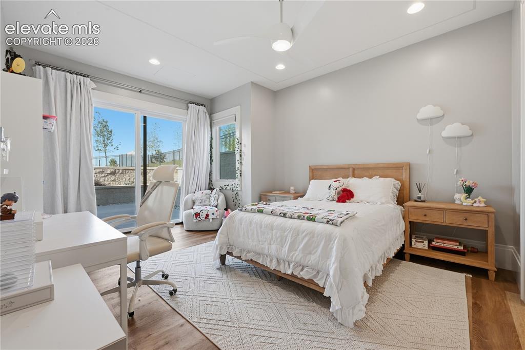 Image 39 of 50: Recessed lighting, wood-finish flooring, ceiling fan with integrated light,