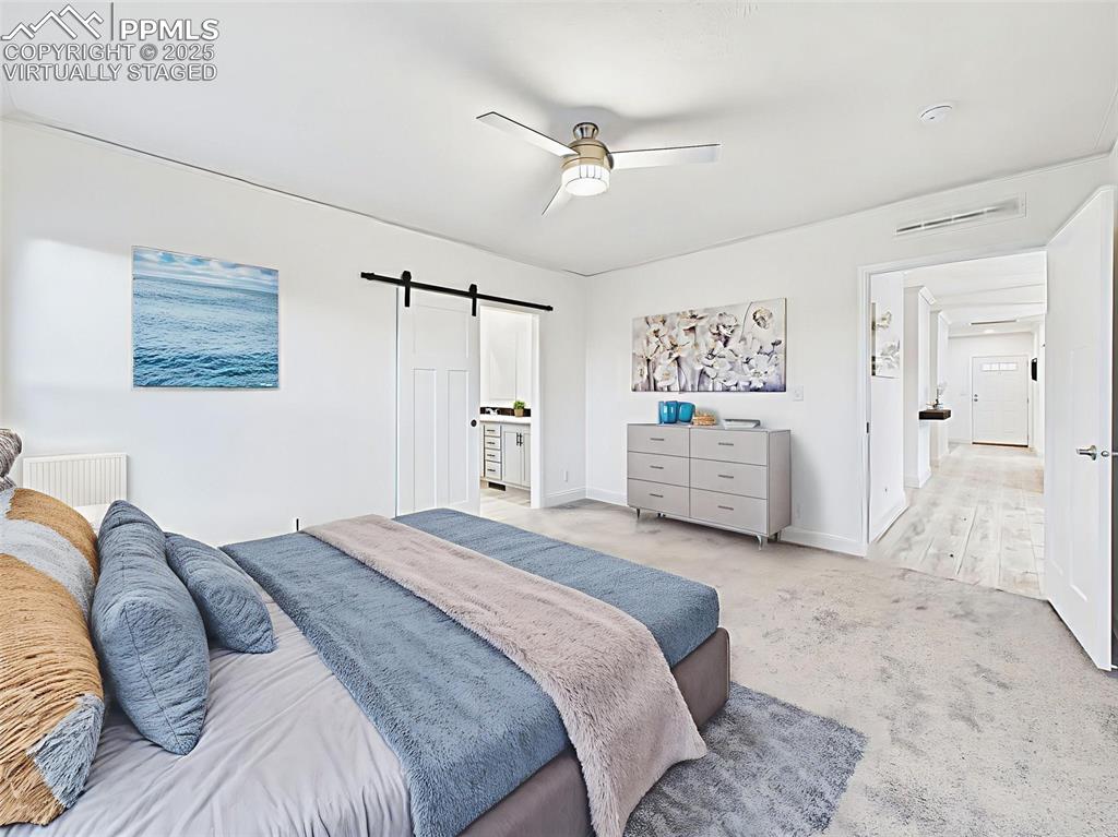 Image 26 of 50: Virtually Staged Alternate view of the primary suite showing ensuite entry