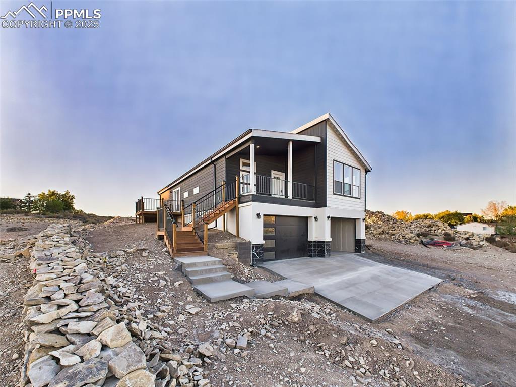 Image 48 of 50: Full front and side angle highlighting architectural lines, stairs, and wra