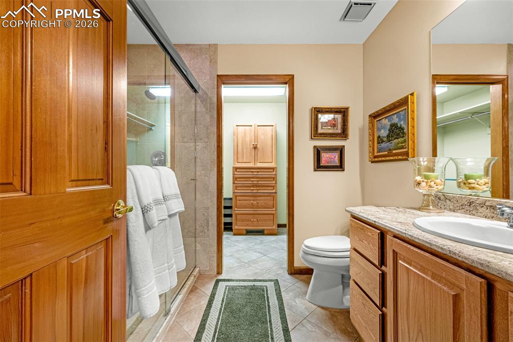 Image 17 of 40: Bathroom off of primary bedroom