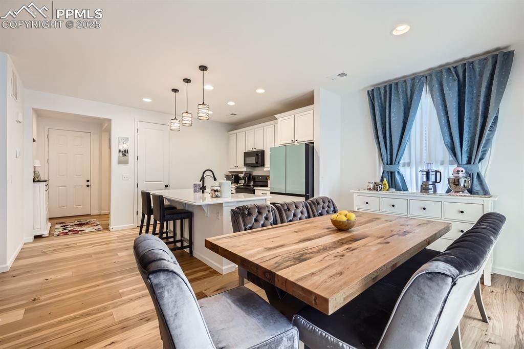 Image 10 of 28: Dining area featuring recessed lighting and light wood-type flooring