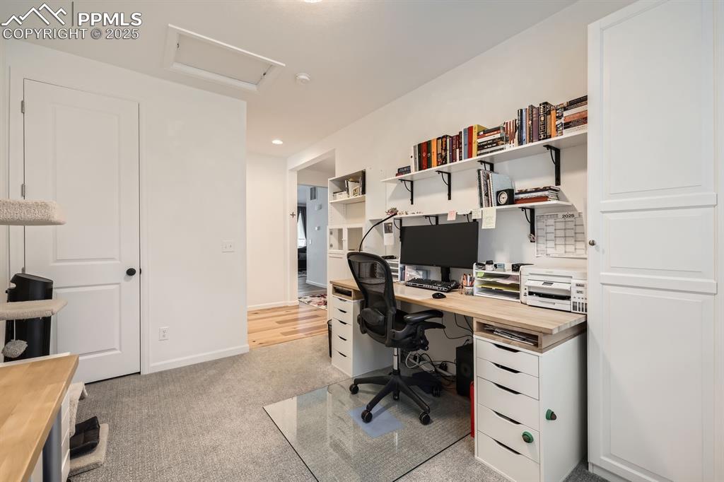 Image 15 of 28: Office area with attic access, light colored carpet, and recessed lighting