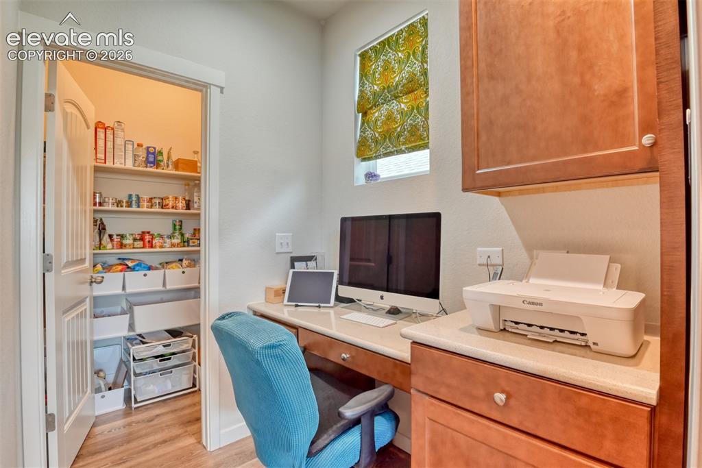 Image 12 of 46: Desk in Kitchen with Pantry
