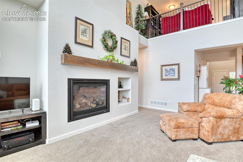 Image 7 of 46: Main Floor Living Room with Fireplace