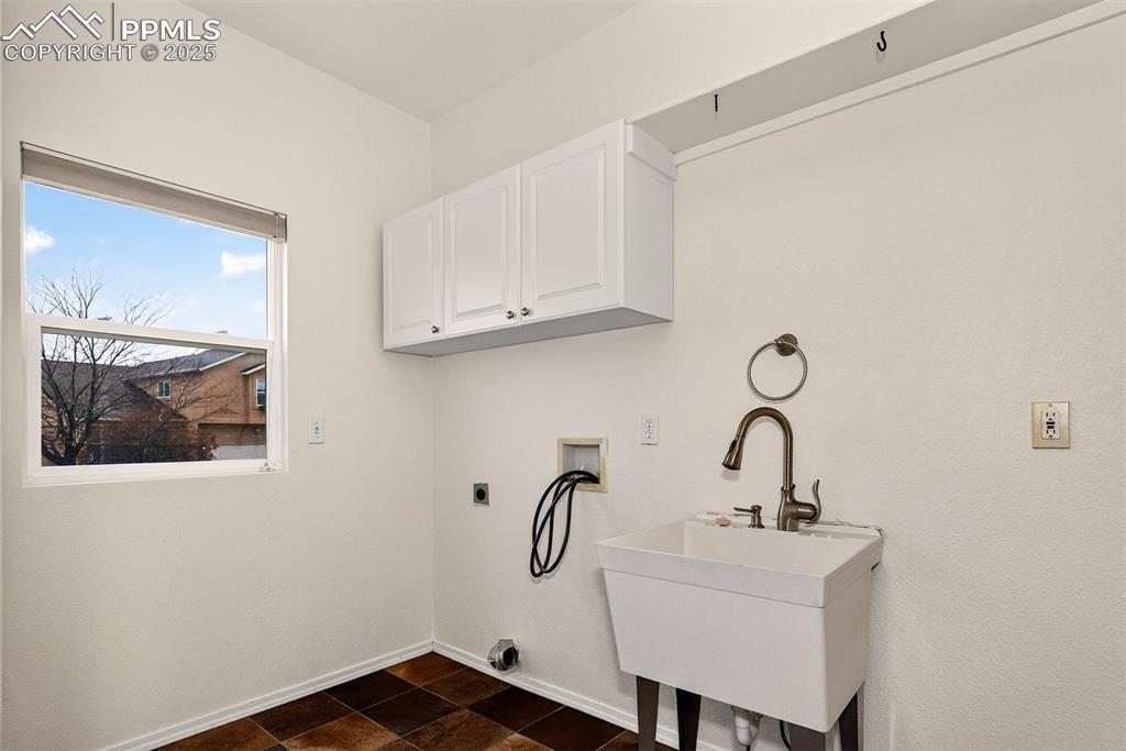 Image 19 of 49: Main Level Laundry wit Fresh Paint