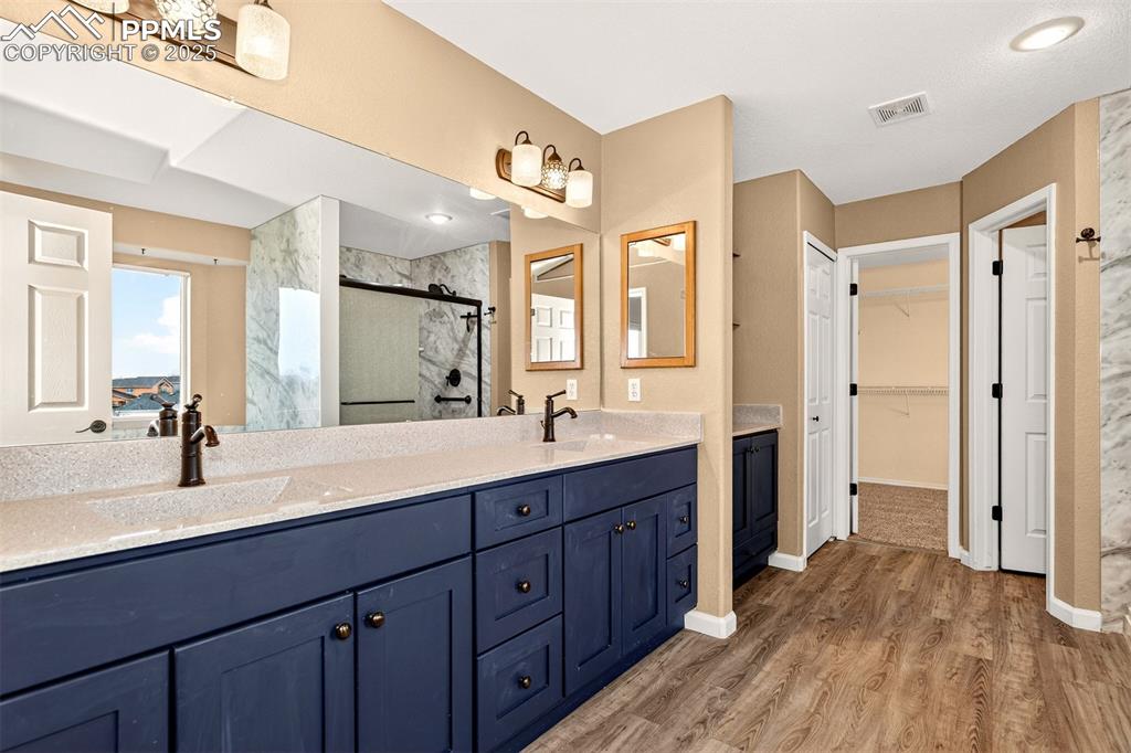 Image 24 of 49: Newly Remodeled Primary Bath with Dual Vanities 