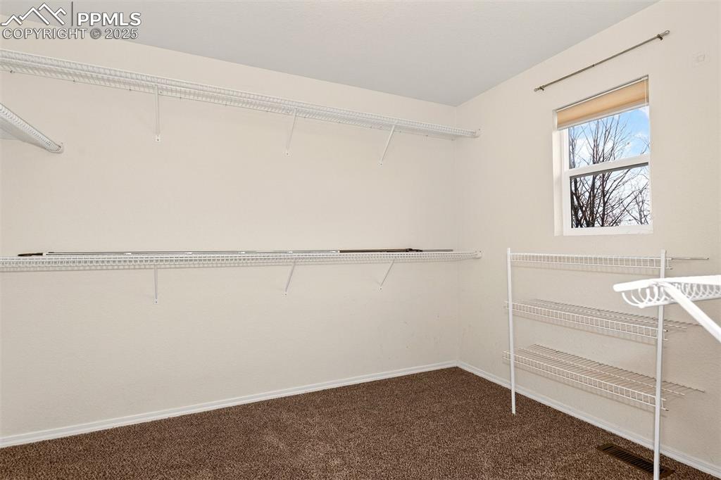 Image 26 of 49: Large Walk-in Closet