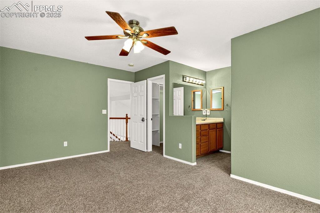 Image 29 of 49: Second Bedroom with Personal Sink & Adjoing Bath