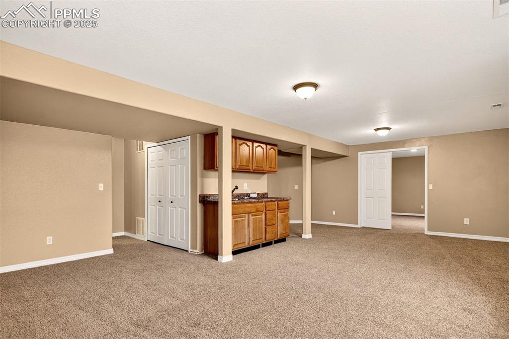 Image 34 of 49: Large Open Basement with Wet Bar