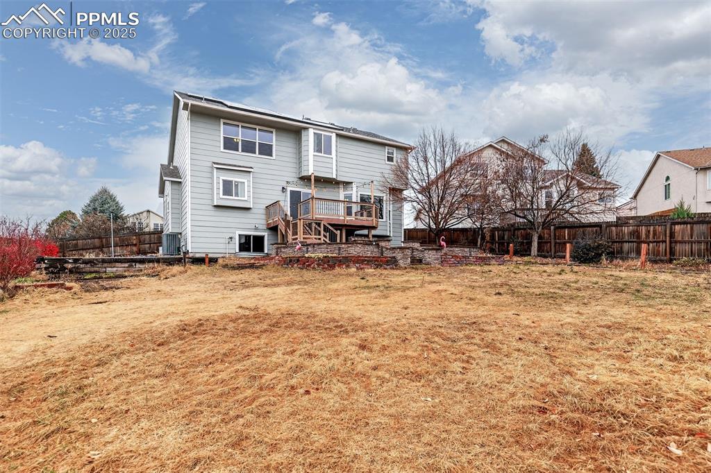 Image 44 of 49: Large Fenced .24 Acre Back Yard