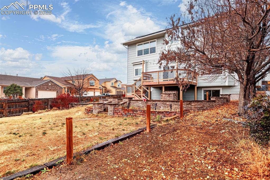 Image 45 of 49: Large Fenced .24 Acre Back Yard