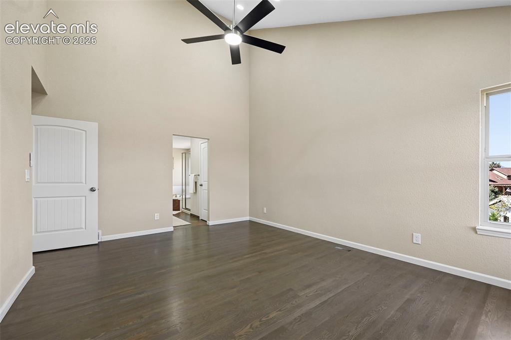 Image 15 of 16: Primary bedroom walk out to deck