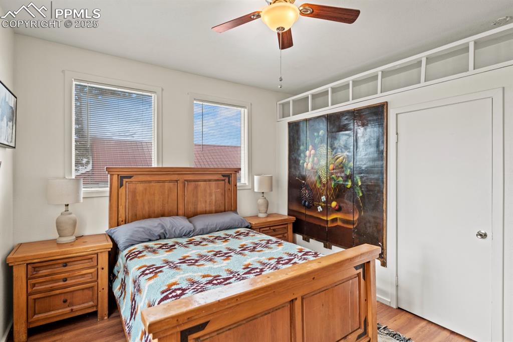 Image 12 of 28: Bedroom with light wood-style flooring and ceiling fan