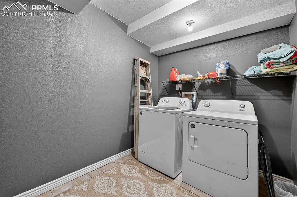 Image 20 of 21: Laundry on basement level.