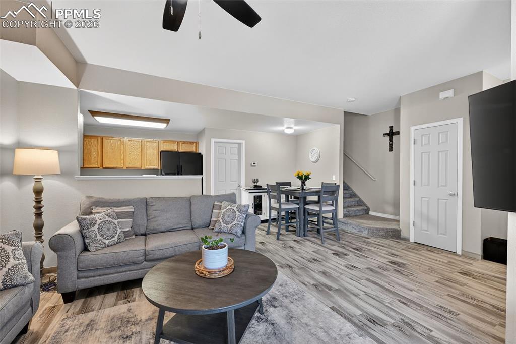 Image 6 of 21: View from the living room, hall closet and stairway to upstairs area. 