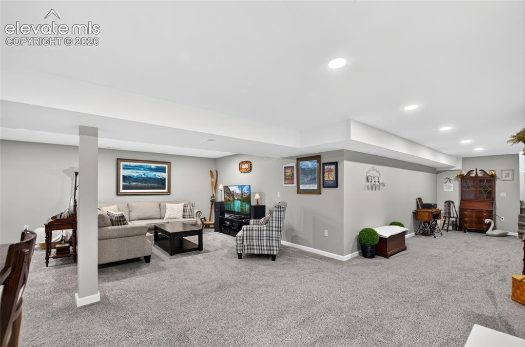 Image 21 of 43: Expansive finished lower level featuring recessed lighting, a neutral gray 