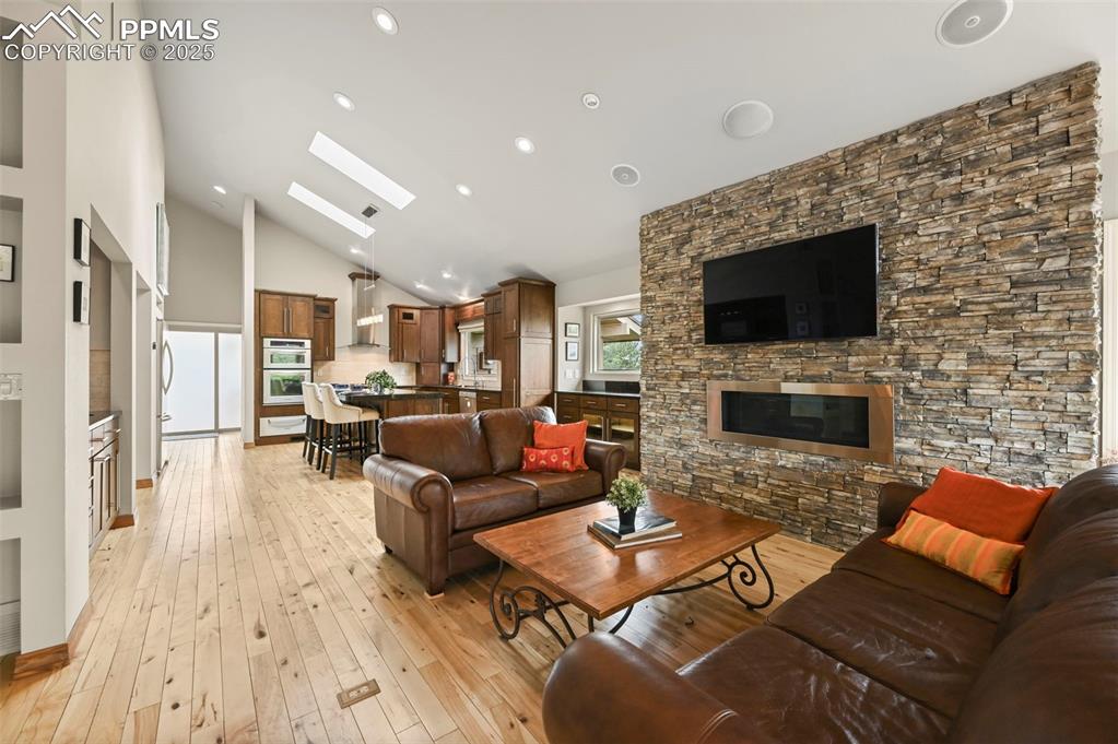 Image 12 of 49: Gas fireplace in great room