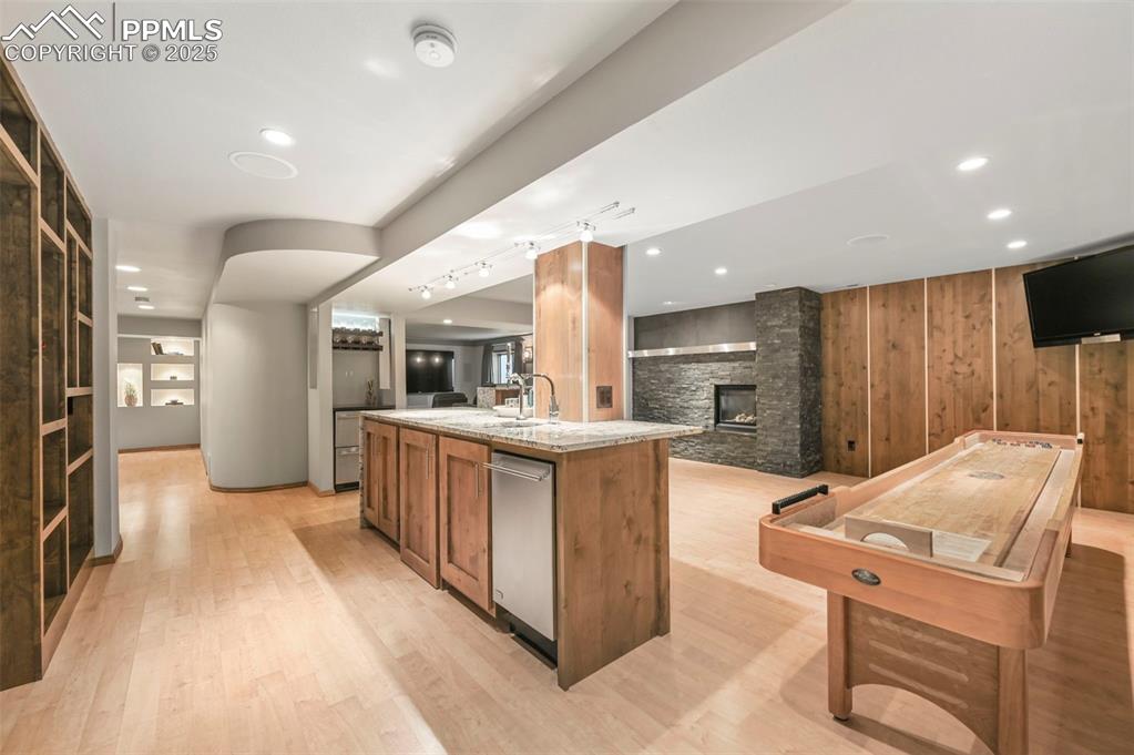 Image 36 of 49: Lower level family room is perfect for entertaining