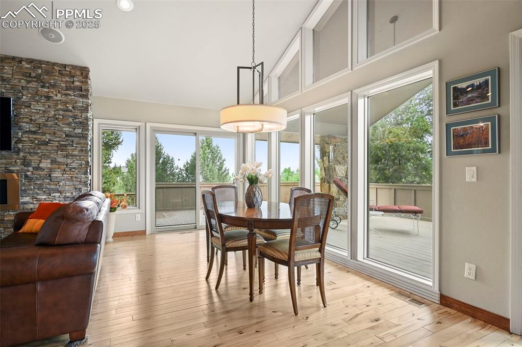 Image 7 of 49: Dining area with windows on two sides