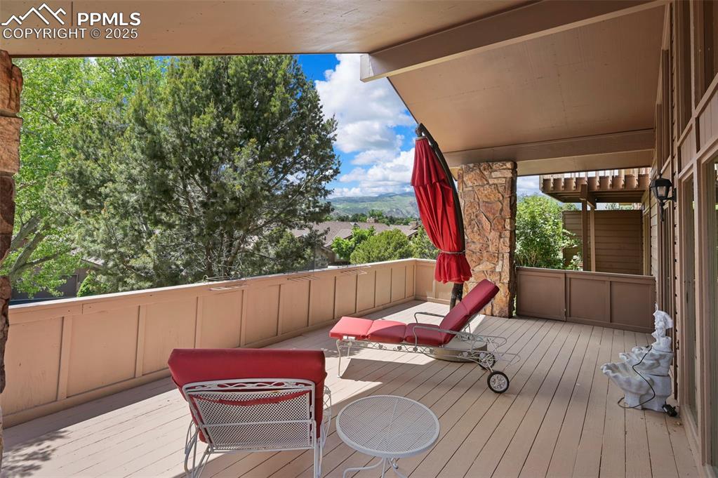 Image 9 of 49: Covered deck area off the great room