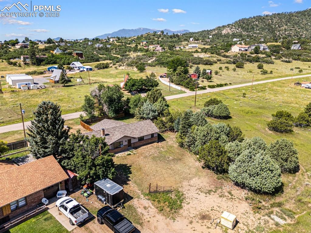 Image 32 of 38: View of rural area featuring a mountainous background